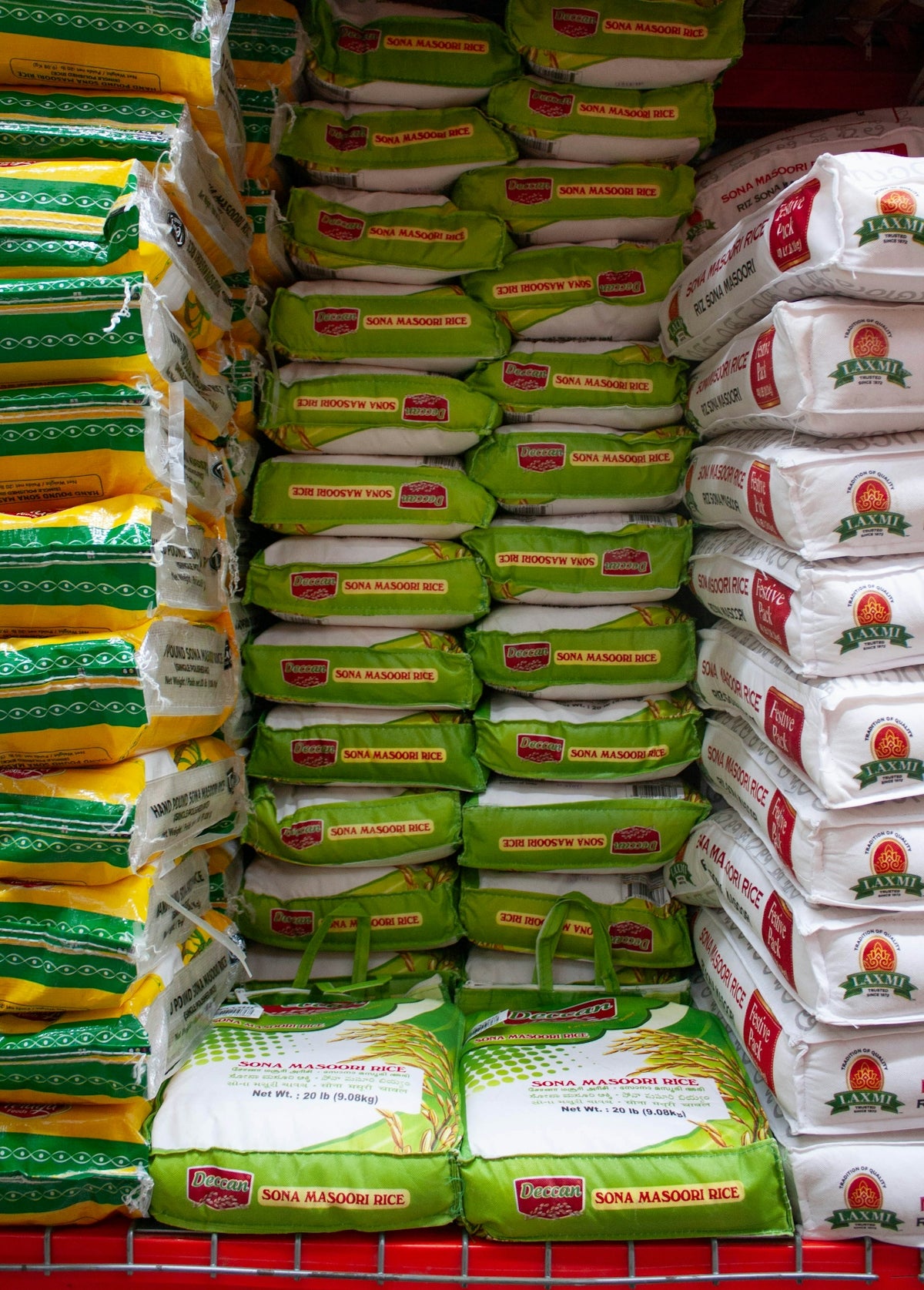 A grocery cart filled with lots of bags of food